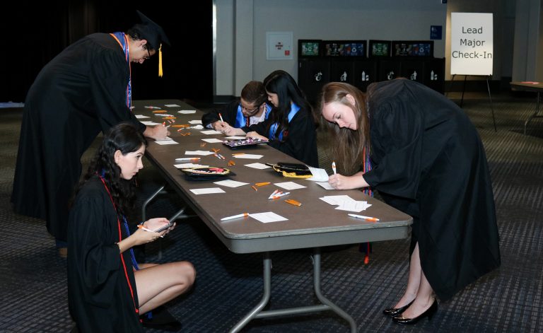 Students filling out name cards