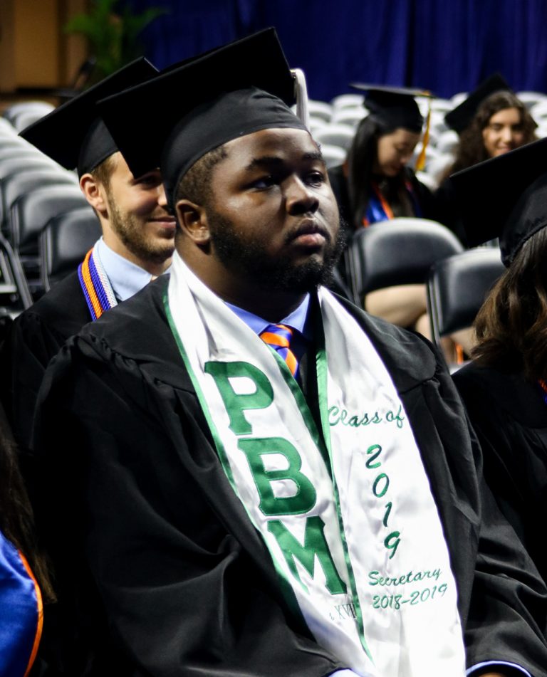 Student sitting during commencement