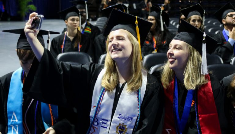 Graduating students taking a selfie