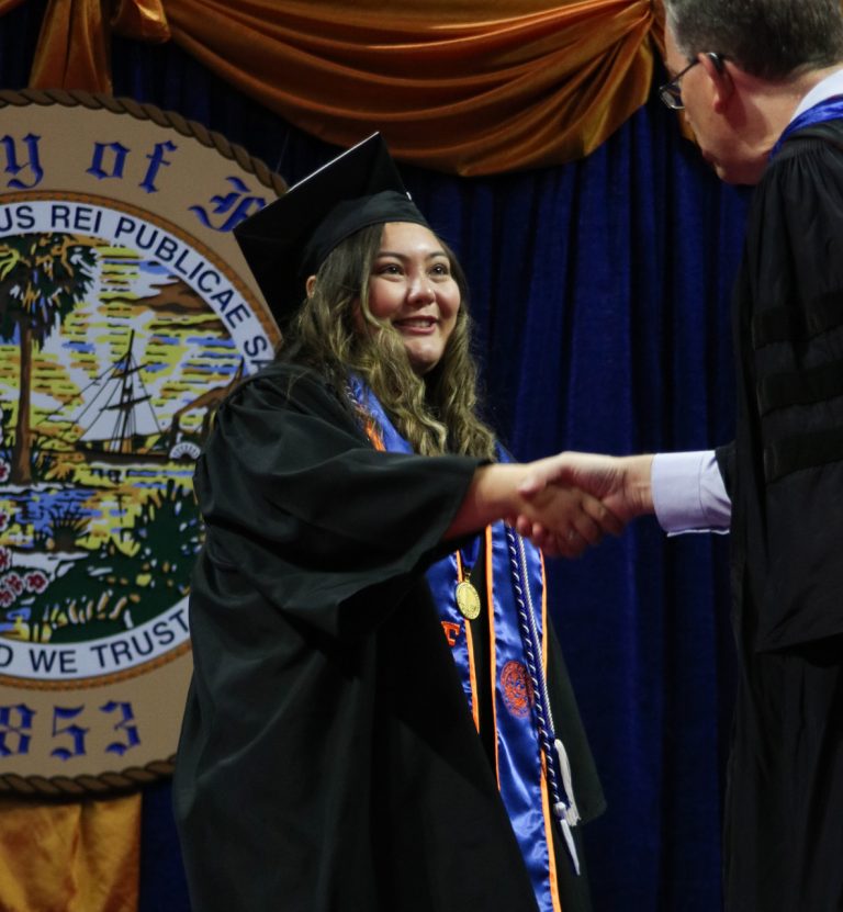 Graduating students shaking hands