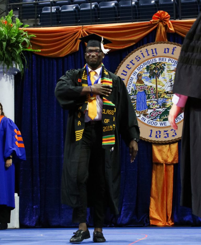 Graduating student walking on stage