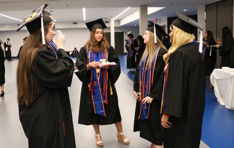 Graduating students talking
