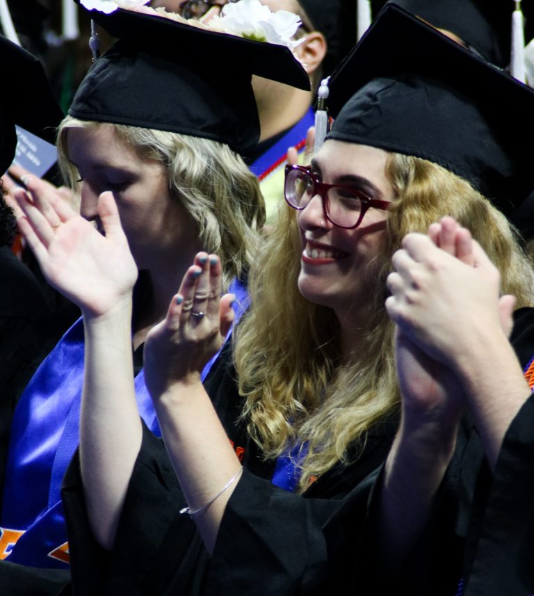 Graduating student clapping