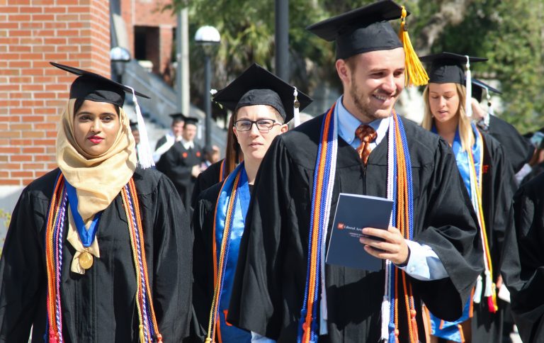 Graduating students walking outside