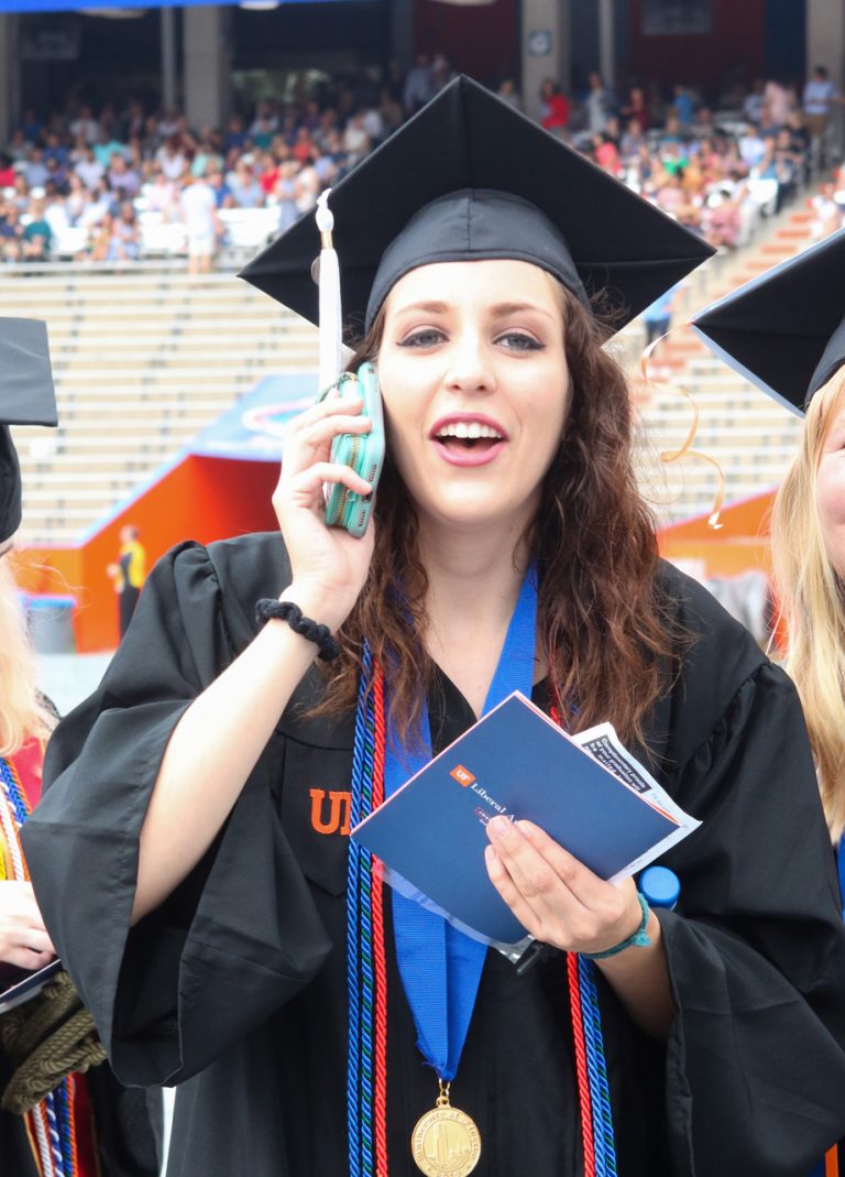 Graduating student talking on the phone