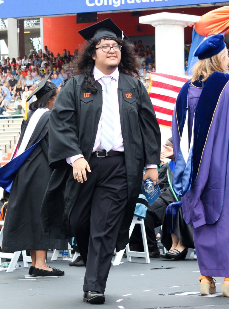 Graduating student walking on stage